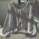 Frenchy cardigan de punto unicolor de color rosa palido con cinturon delantero, se puede usar sobre una camiseta