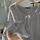 Frenchy cardigan de punto unicolor de color rosa palido con cinturon delantero, se puede usar sobre una camiseta