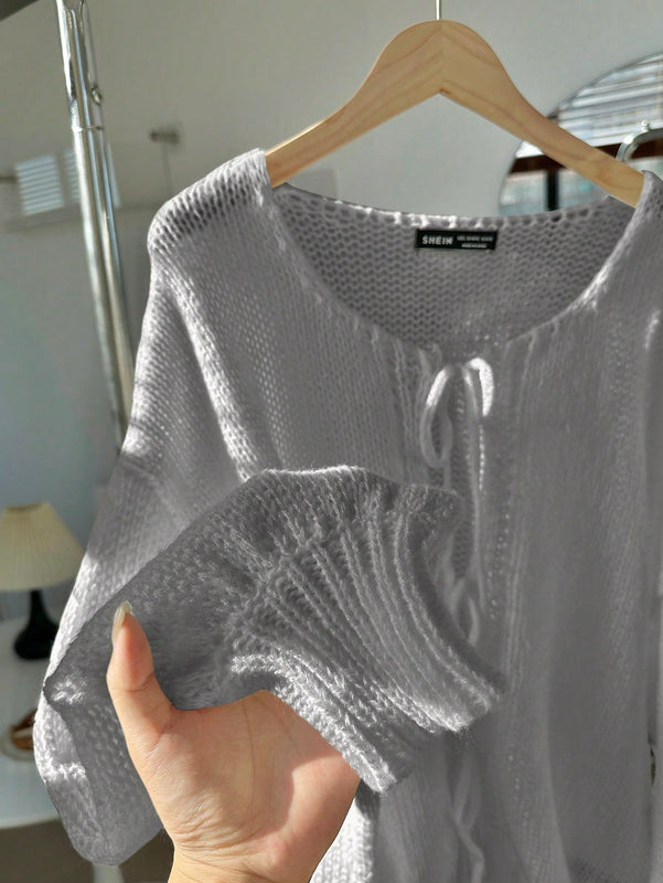 Frenchy cardigan de punto unicolor de color rosa palido con cinturon delantero, se puede usar sobre una camiseta