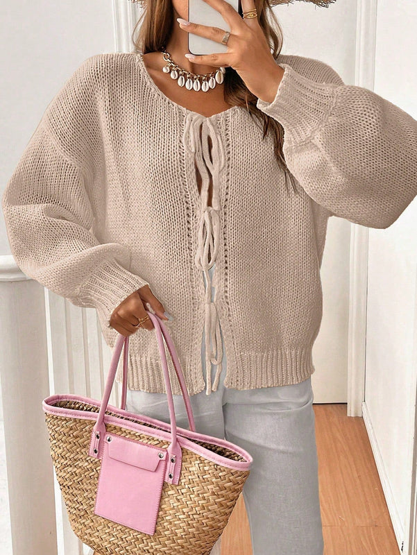 Frenchy cardigan de punto unicolor de color rosa palido con cinturon delantero, se puede usar sobre una camiseta