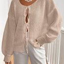 Frenchy cardigan de punto unicolor de color rosa palido con cinturon delantero, se puede usar sobre una camiseta