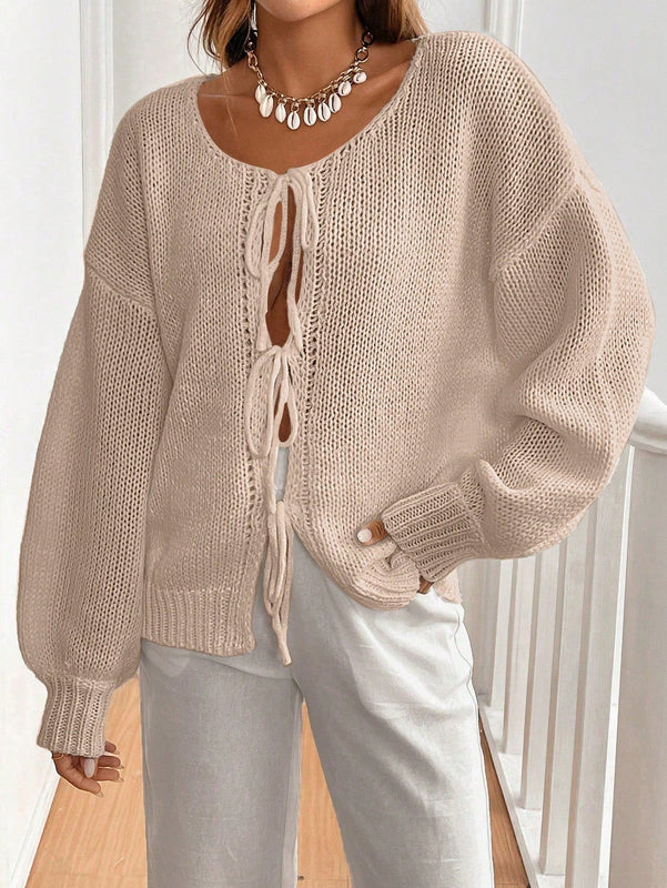 Frenchy cardigan de punto unicolor de color rosa palido con cinturon delantero, se puede usar sobre una camiseta