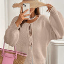 Frenchy cardigan de punto unicolor de color rosa palido con cinturon delantero, se puede usar sobre una camiseta