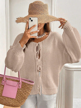 Frenchy cardigan de punto unicolor de color rosa palido con cinturon delantero, se puede usar sobre una camiseta