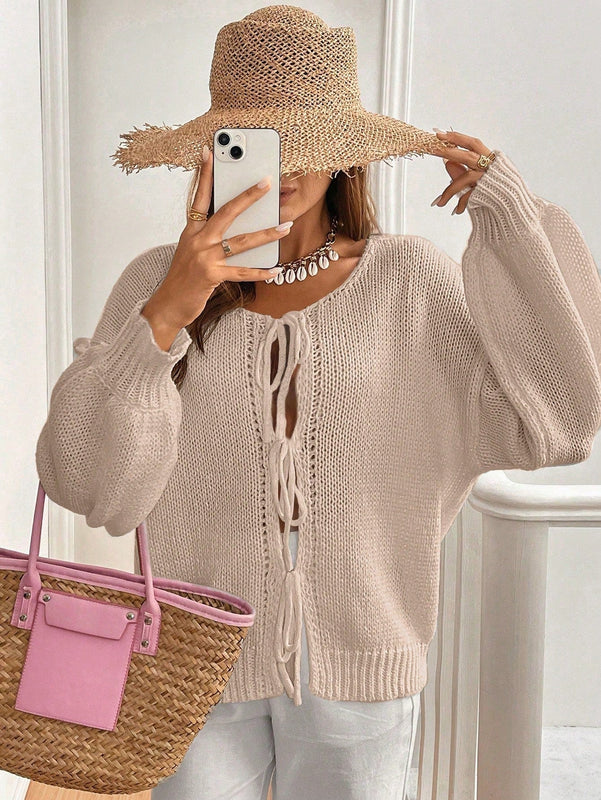 Frenchy cardigan de punto unicolor de color rosa palido con cinturon delantero, se puede usar sobre una camiseta