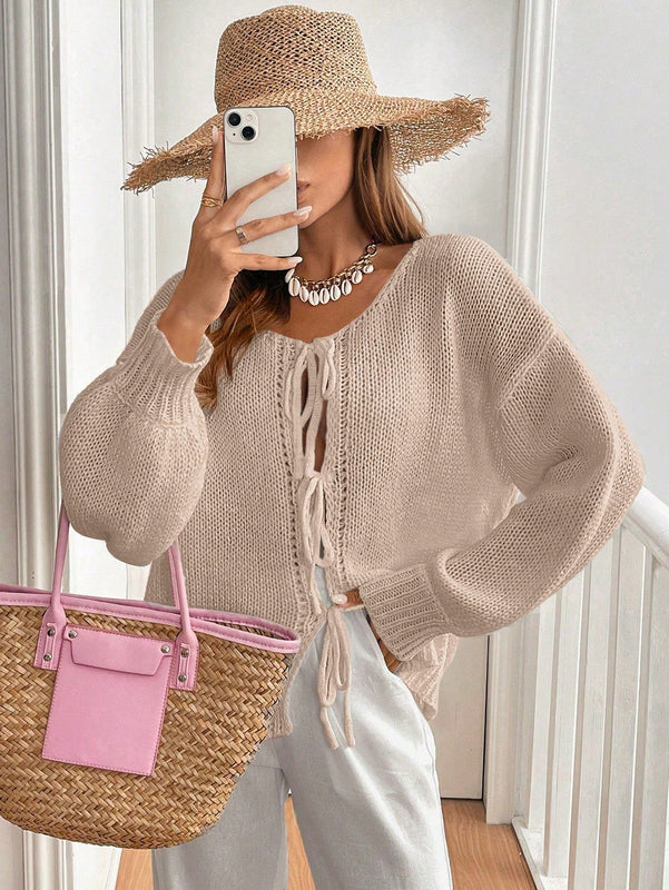 Frenchy cardigan de punto unicolor de color rosa palido con cinturon delantero, se puede usar sobre una camiseta
