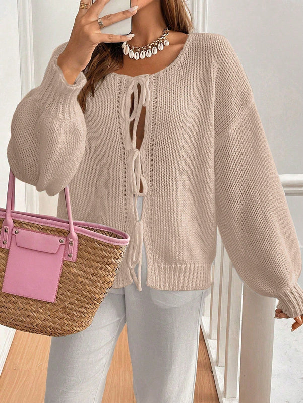 Frenchy cardigan de punto unicolor de color rosa palido con cinturon delantero, se puede usar sobre una camiseta