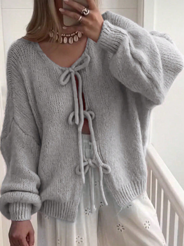 Frenchy cardigan de punto unicolor de color rosa palido con cinturon delantero, se puede usar sobre una camiseta