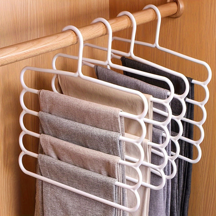 Colgador de pantalones de plástico de 5 niveles ahorrador de espacio, organizador versátil de armario para pantalones, faldas, bufandas con organización para el hogar