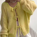 Frenchy cardigan de punto unicolor de color rosa palido con cinturon delantero, se puede usar sobre una camiseta