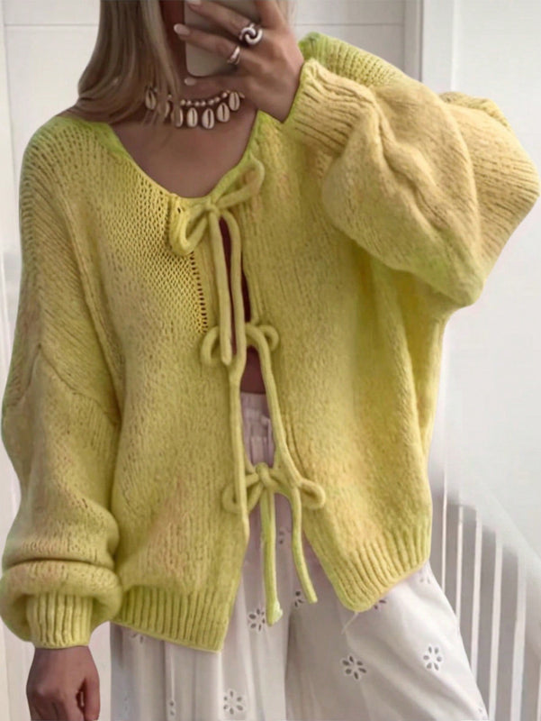 Frenchy cardigan de punto unicolor de color rosa palido con cinturon delantero, se puede usar sobre una camiseta