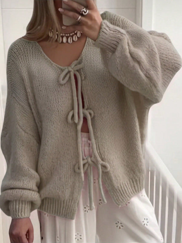 Frenchy cardigan de punto unicolor de color rosa palido con cinturon delantero, se puede usar sobre una camiseta