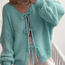 Frenchy cardigan de punto unicolor de color rosa palido con cinturon delantero, se puede usar sobre una camiseta