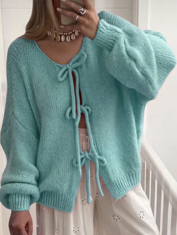 Frenchy cardigan de punto unicolor de color rosa palido con cinturon delantero, se puede usar sobre una camiseta