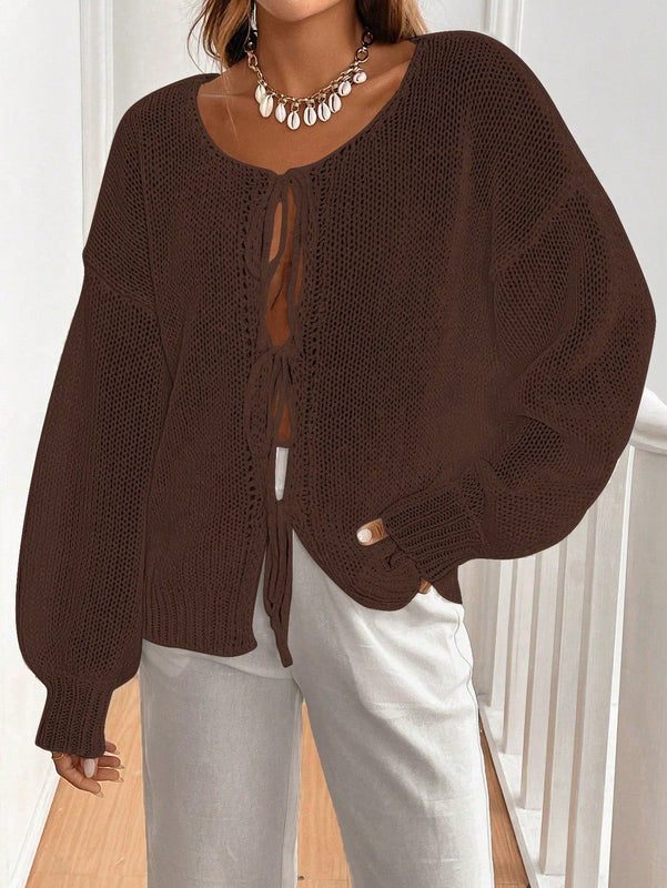 Frenchy cardigan de punto unicolor de color rosa palido con cinturon delantero, se puede usar sobre una camiseta