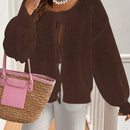 Frenchy cardigan de punto unicolor de color rosa palido con cinturon delantero, se puede usar sobre una camiseta