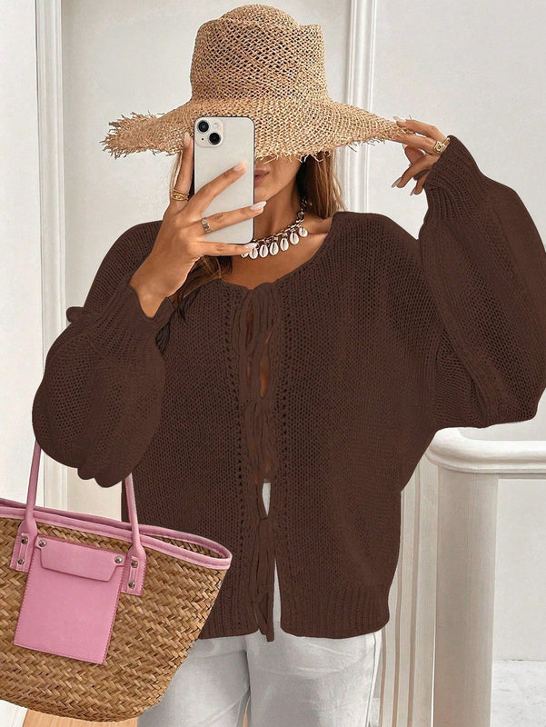 Frenchy cardigan de punto unicolor de color rosa palido con cinturon delantero, se puede usar sobre una camiseta