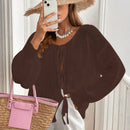 Frenchy cardigan de punto unicolor de color rosa palido con cinturon delantero, se puede usar sobre una camiseta