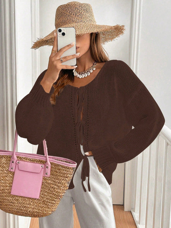 Frenchy cardigan de punto unicolor de color rosa palido con cinturon delantero, se puede usar sobre una camiseta