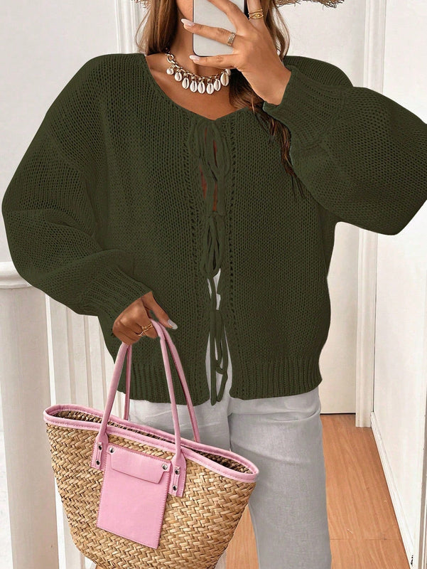 Frenchy cardigan de punto unicolor de color rosa palido con cinturon delantero, se puede usar sobre una camiseta