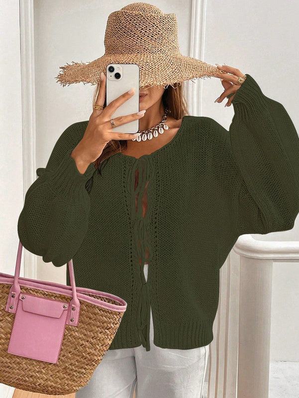 Frenchy cardigan de punto unicolor de color rosa palido con cinturon delantero, se puede usar sobre una camiseta