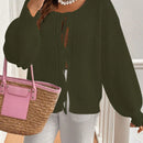 Frenchy cardigan de punto unicolor de color rosa palido con cinturon delantero, se puede usar sobre una camiseta