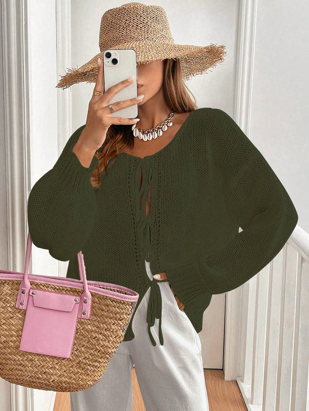 Frenchy cardigan de punto unicolor de color rosa palido con cinturon delantero, se puede usar sobre una camiseta