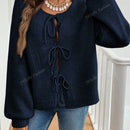 Cardigan de punto de color liso con detalle de nudo delantero, de estilo minimalista para uso en la oficina, atemporal y femenino. cardigan de punto en un solo color con abertura frontal que se puede usar sobre blusas, un cardigan oversize y adorable