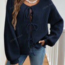 Cardigan de punto de color liso con detalle de nudo delantero, de estilo minimalista para uso en la oficina, atemporal y femenino. cardigan de punto en un solo color con abertura frontal que se puede usar sobre blusas, un cardigan oversize y adorable