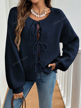 Cardigan de punto de color liso con detalle de nudo delantero, de estilo minimalista para uso en la oficina, atemporal y femenino. cardigan de punto en un solo color con abertura frontal que se puede usar sobre blusas, un cardigan oversize y adorable