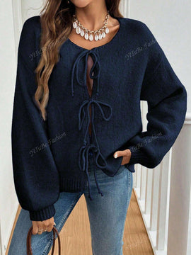 Cardigan de punto de color liso con detalle de nudo delantero, de estilo minimalista para uso en la oficina, atemporal y femenino. cardigan de punto en un solo color con abertura frontal que se puede usar sobre blusas, un cardigan oversize y adorable