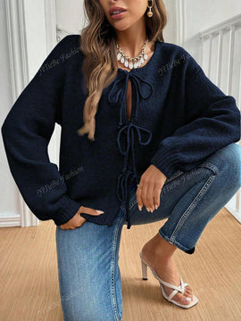 Cardigan de punto de color liso con detalle de nudo delantero, de estilo minimalista para uso en la oficina, atemporal y femenino. cardigan de punto en un solo color con abertura frontal que se puede usar sobre blusas, un cardigan oversize y adorable