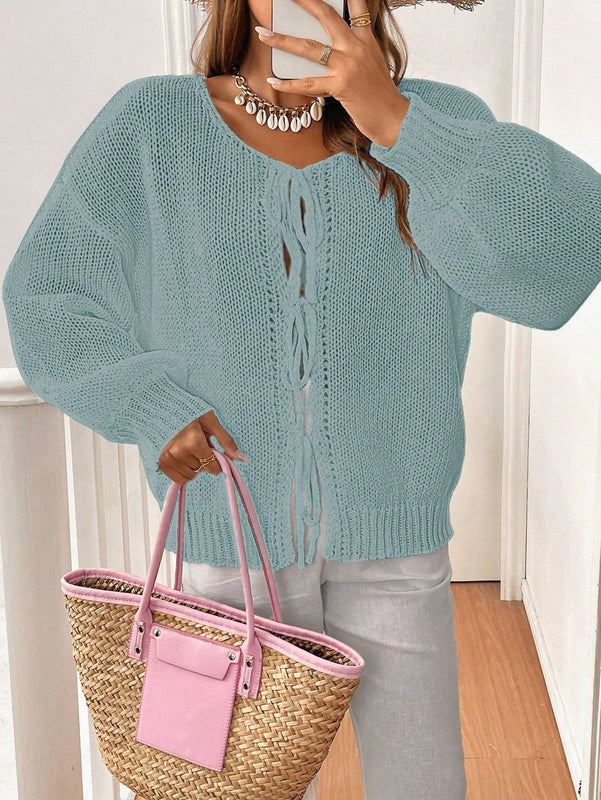 Frenchy cardigan de punto unicolor de color rosa palido con cinturon delantero, se puede usar sobre una camiseta