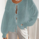 Frenchy cardigan de punto unicolor de color rosa palido con cinturon delantero, se puede usar sobre una camiseta