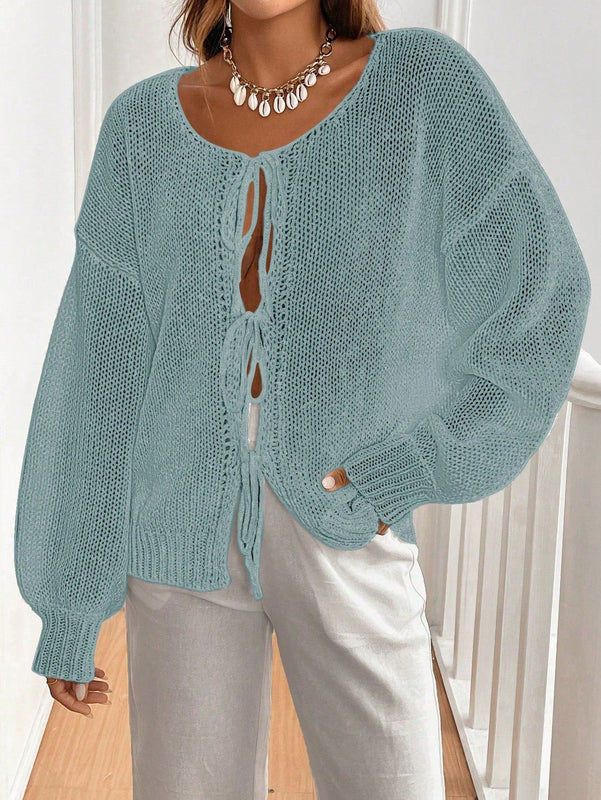 Frenchy cardigan de punto unicolor de color rosa palido con cinturon delantero, se puede usar sobre una camiseta