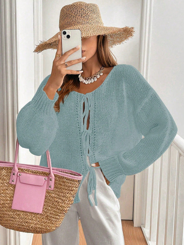Frenchy cardigan de punto unicolor de color rosa palido con cinturon delantero, se puede usar sobre una camiseta