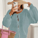 Frenchy cardigan de punto unicolor de color rosa palido con cinturon delantero, se puede usar sobre una camiseta