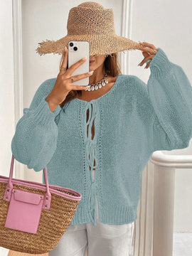 Frenchy cardigan de punto unicolor de color rosa palido con cinturon delantero, se puede usar sobre una camiseta
