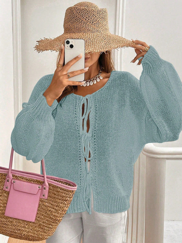 Frenchy cardigan de punto unicolor de color rosa palido con cinturon delantero, se puede usar sobre una camiseta