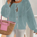 Frenchy cardigan de punto unicolor de color rosa palido con cinturon delantero, se puede usar sobre una camiseta