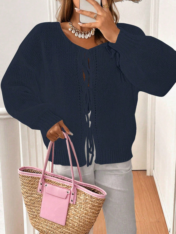 Frenchy cardigan de punto unicolor de color rosa palido con cinturon delantero, se puede usar sobre una camiseta