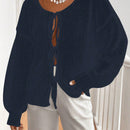 Frenchy cardigan de punto unicolor de color rosa palido con cinturon delantero, se puede usar sobre una camiseta