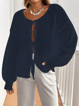 Frenchy cardigan de punto unicolor de color rosa palido con cinturon delantero, se puede usar sobre una camiseta
