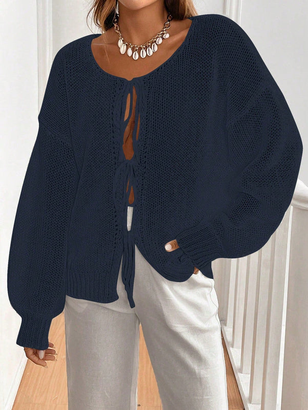 Frenchy cardigan de punto unicolor de color rosa palido con cinturon delantero, se puede usar sobre una camiseta