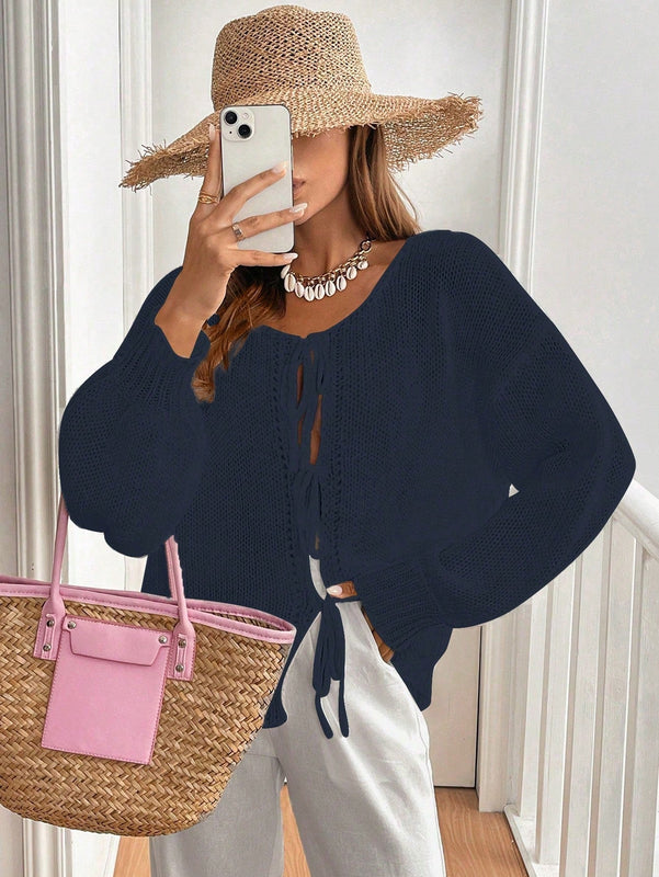 Frenchy cardigan de punto unicolor de color rosa palido con cinturon delantero, se puede usar sobre una camiseta