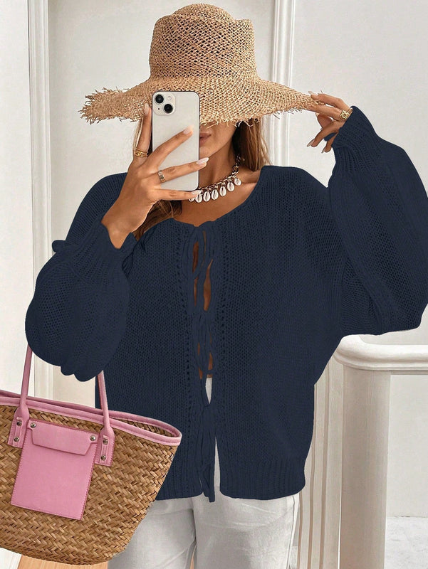 Frenchy cardigan de punto unicolor de color rosa palido con cinturon delantero, se puede usar sobre una camiseta