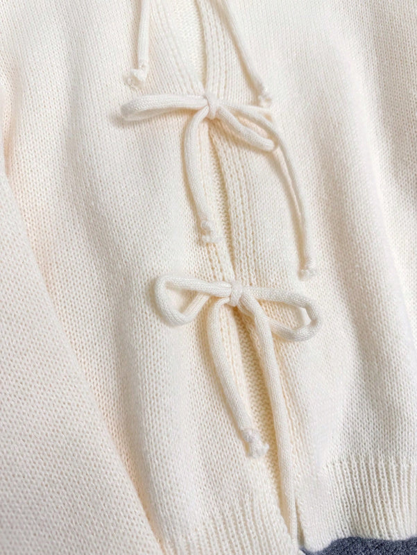 Cardigan de punto de color liso con detalle de nudo delantero, de estilo minimalista para uso en la oficina, atemporal y femenino. cardigan de punto en un solo color con abertura frontal que se puede usar sobre blusas, un cardigan oversize y adorable
