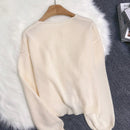 Cardigan de punto de color liso con detalle de nudo delantero, de estilo minimalista para uso en la oficina, atemporal y femenino. cardigan de punto en un solo color con abertura frontal que se puede usar sobre blusas, un cardigan oversize y adorable