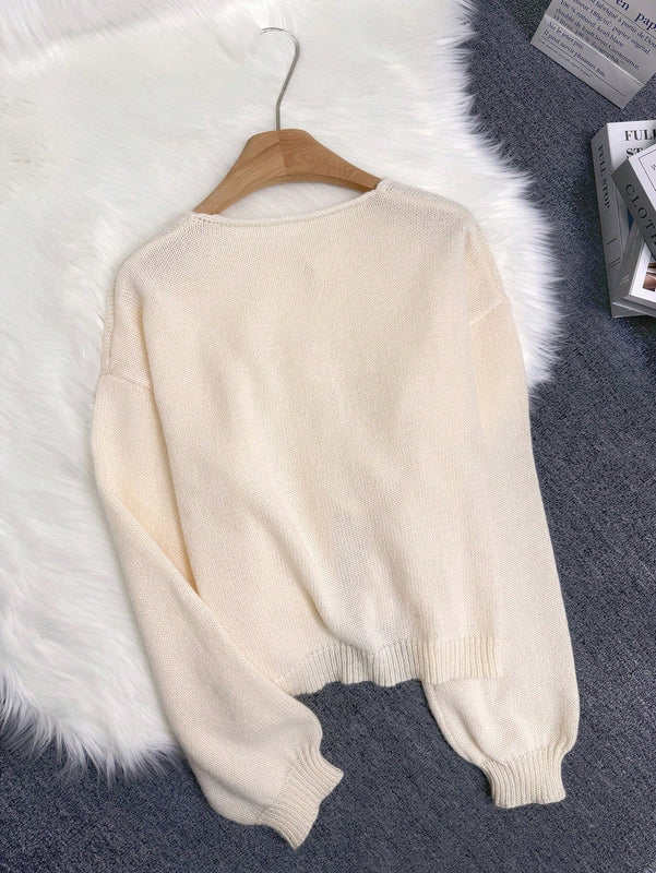 Cardigan de punto de color liso con detalle de nudo delantero, de estilo minimalista para uso en la oficina, atemporal y femenino. cardigan de punto en un solo color con abertura frontal que se puede usar sobre blusas, un cardigan oversize y adorable