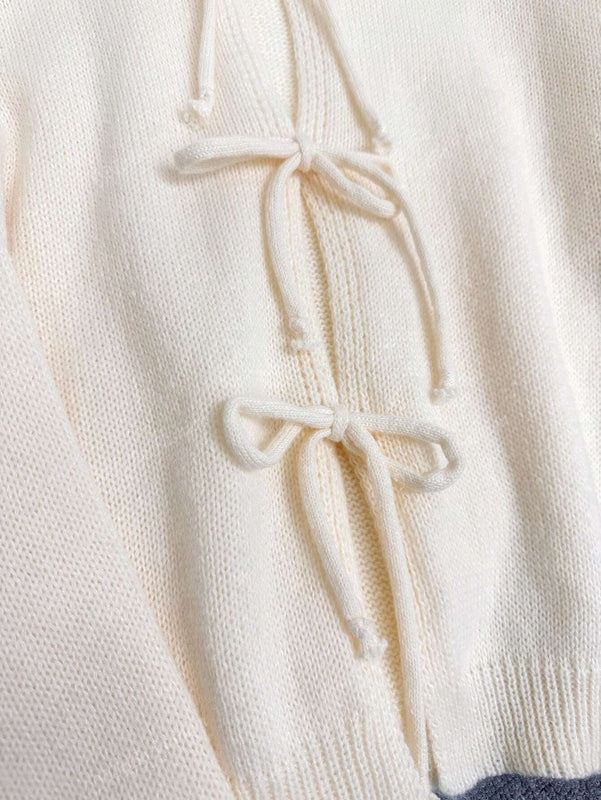 Cardigan de punto de color liso con detalle de nudo delantero, de estilo minimalista para uso en la oficina, atemporal y femenino. cardigan de punto en un solo color con abertura frontal que se puede usar sobre blusas, un cardigan oversize y adorable